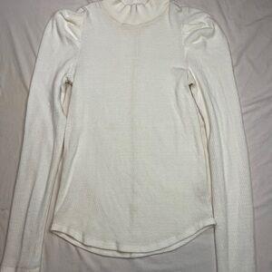 Free People long-sleeve mock neck thermal top featuring pleated puff shoulders